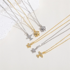 Exquisite airplane, elephant, and turtle zircon pendant necklaces in gold and silver finish