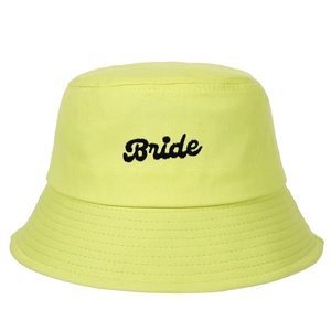 Close-up of black Bride embroidery on a neon yellow canvas bucket hat with stitching detail