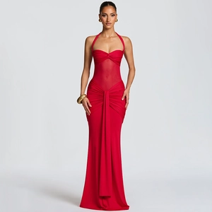 Detail of red ruched dress featuring backless design and sheer mesh waist patchwork