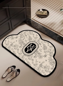 Detail of flower pattern bathroom mat with anti-slip texture and lucky logo