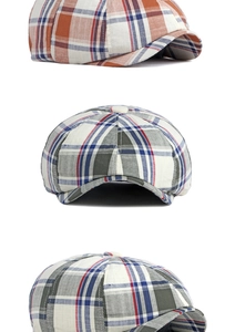 Detailed views of vintage plaid newsboy hat in orange and grey textured wool fabric