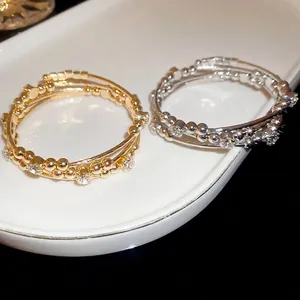 Elegant multi-layer spiral open bracelets in gold and silver with zircon accents