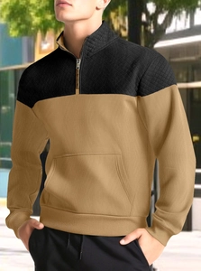 Detail of men waffle knit sweatshirt with diamond quilted texture and half-zip collar