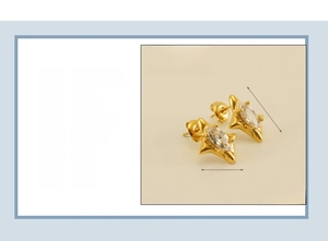 Detail view of gold starburst earrings with marquise-cut zircon in stainless steel