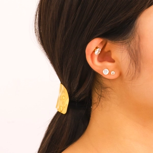 Minimalist gold ear cuff and cubic zirconia stud earring set for women on model
