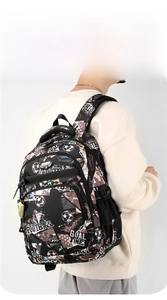 Detail view of the padded shoulder straps on the football printed student backpack
