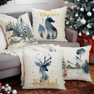 Christmas pillow covers featuring deer and fox print on a cozy grey sofa in a winter scene