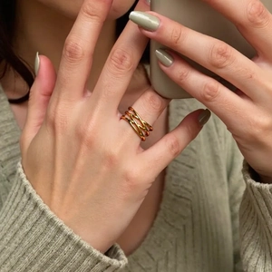 Minimalist 18K gold plated multi-layer crisscross ring for women on a model finger