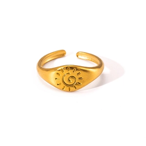 Detailed view of the gold adjustable ring featuring a unique sun spiral texture design