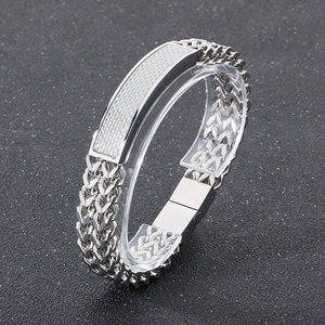 Detail of silver titanium steel hip hop bracelet with braided texture plate and magnetic clasp