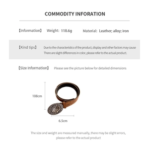 Detailed view of vintage leather waist belt featuring engraved rose pattern on the buckle