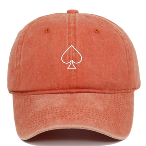 Close-up of vintage washed cotton baseball cap with white spade heart embroidery