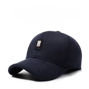 Close-up of a navy blue winter baseball cap featuring a golf logo and thermal fabric
