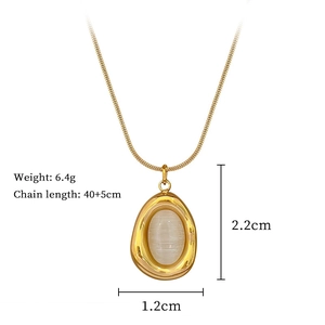 Detail of gold teardrop cat eye stone necklace with dimensions 2.2cm and 40+5cm chain