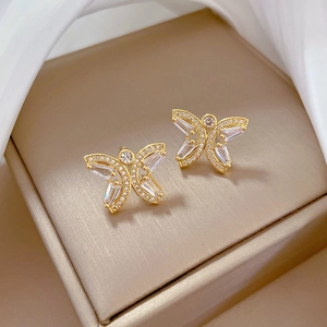 Detailed close-up of hollow butterfly stud earrings with sparkling cubic zirconia stones