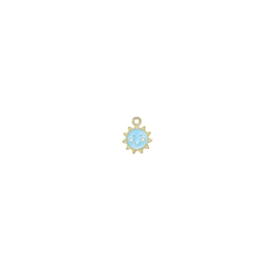 Detail shot of a small gold sun pendant with blue enamel face and sparkling gem eyes