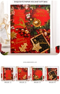 Close-up of extra large paper Christmas gift bags with gold foil and glitter details