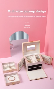 Close-up of the three-layer jewelry box showing pink PU leather and drawer design