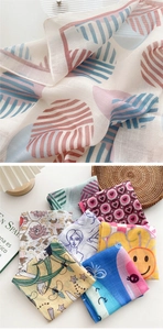 Detail of printed cotton linen square scarf showing woven texture and hemmed edges