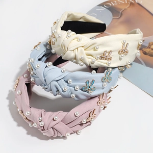 Three-piece set of knotted fabric headbands with elegant pearls and enamel rabbit charms