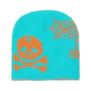 Detail of plush bright blue beanie with orange skull and spider web knit patterns