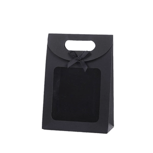Elegant black paper gift bag with clear window, handle, and a decorative ribbon bow tie