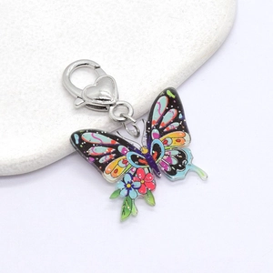 Retro colorful butterfly keychain with acrylic floral print and silver heart-shaped clasp