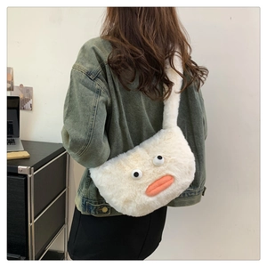 Detail of white plush duck shoulder bag with 3D eyes and orange beak on a model