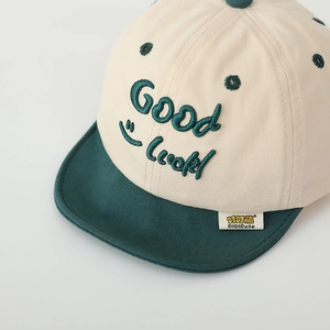 Kids cotton baseball cap with Good Luck embroidery and green contrast visor detail
