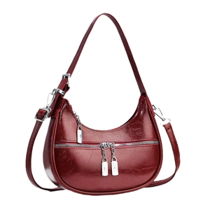 Chic red faux leather crescent hobo bag with silver zippers and spacious interior design