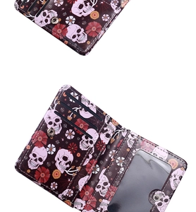 Detail view of gothic spider skull bifold wallet with card slots and ID window