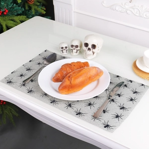 Halloween spider web placemat with black spider patterns for spooky dining table decor