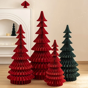 Red and dark green honeycomb paper Christmas trees in various sizes for festive decor
