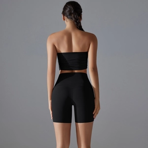 Rear view of black seamless sports set featuring high-waisted biker shorts and tube top