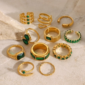 Luxurious gold stainless steel ring set with emerald green stones and snake design