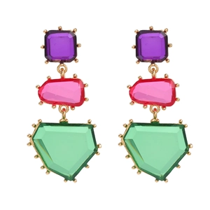 Detail of bohemian drop earrings featuring multi-color crystals and gold metal settings