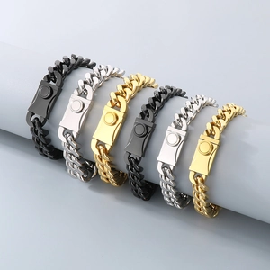 Gold and silver Cuban link bracelets with magnetic clasps on display stands