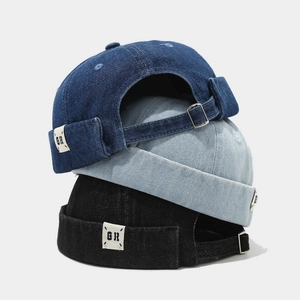 Retro denim docker hats in blue and black with adjustable metal buckles and GR labels