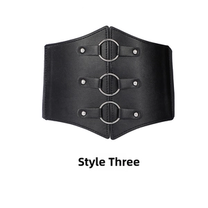 Detail of black wide corset belt featuring three silver metal rings and punk style rivets