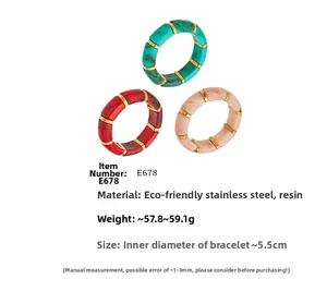 Detail of colorful resin bangles with stainless steel beads and marble texture