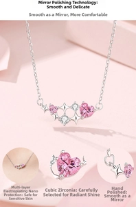 Macro detail of 925 silver heart necklace with pink zirconia and star pendant
