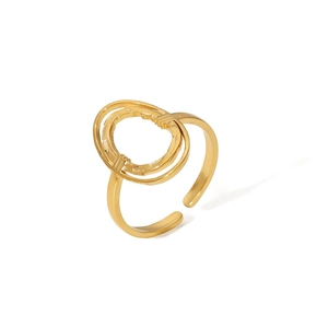 Detail of adjustable golden double ring featuring unique gear texture and geometric circles