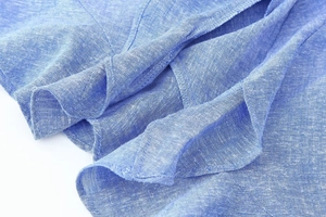 Detailed macro view of the premium blue linen blend fabric and fine stitching finish
