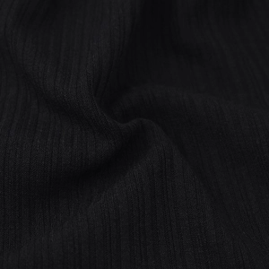 Close-up of black ribbed knit fabric showing the vertical texture and soft elastic weave
