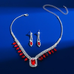 Detailed view of red crystal necklace and earring set with square and teardrop gems