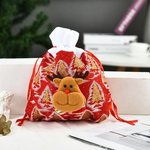 Christmas gift bag with 3D reindeer decor and golden tree pattern for holiday packaging