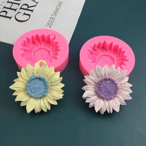 Pink silicone sunflower molds for chocolate and soap making with floral samples