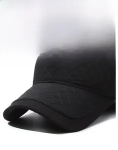 Detail of black quilted baseball cap with windproof texture and Sport woven label
