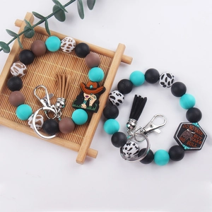 Bohemian silicone beaded wristlet keychain with denim girl charm and tassels