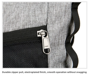 Close-up of premium YKK metal zipper and durable grey fabric on business backpack